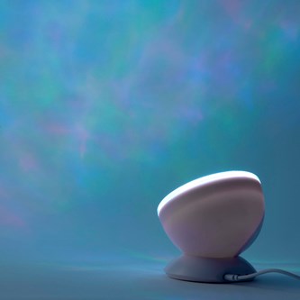 Projektor med vågor och högtalare