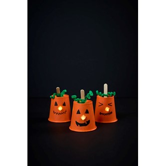 Lysande pumpa av pappmugg